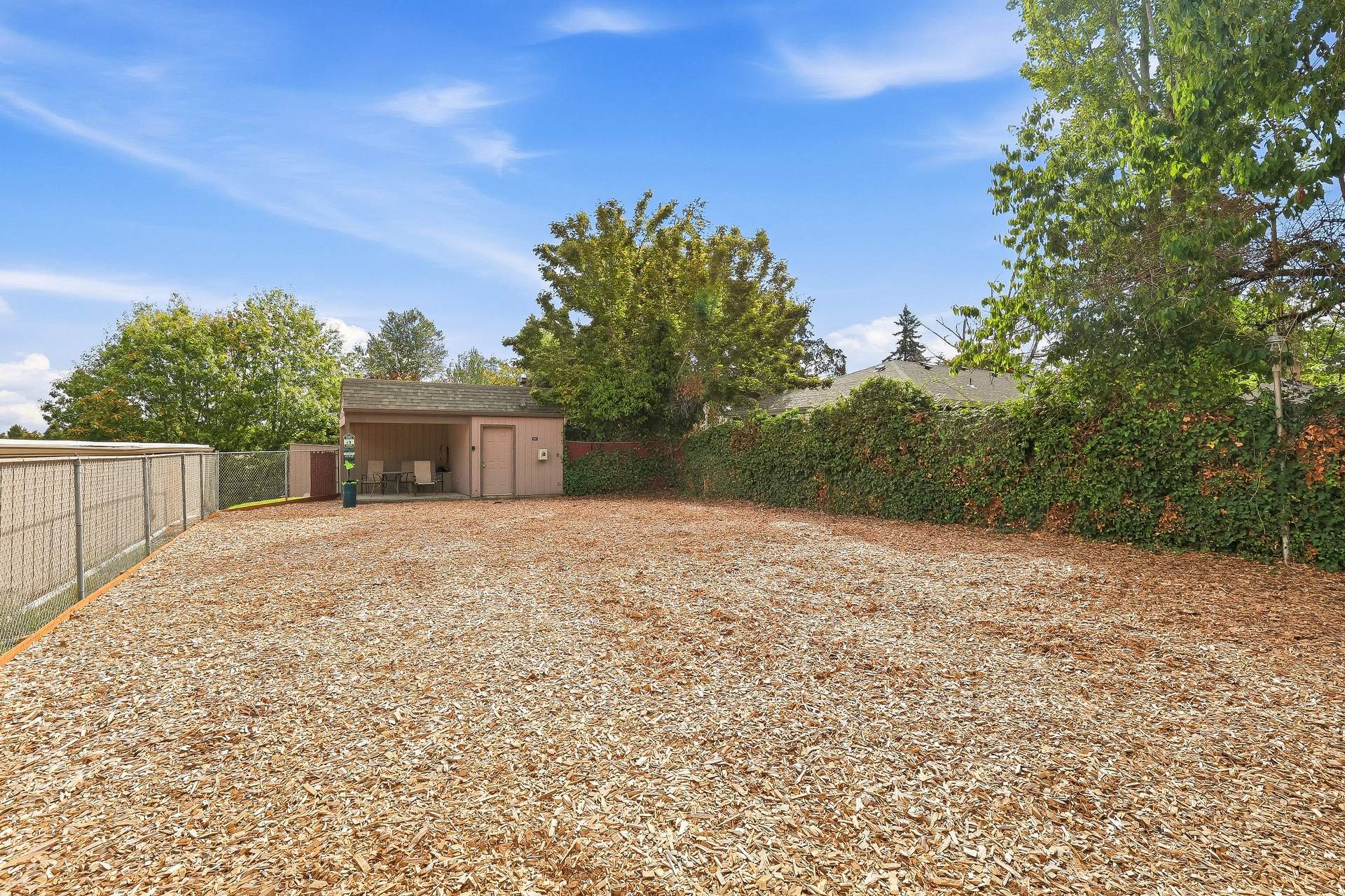 Pinewood Terrace yard with covered patio seating